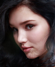 Dark haired beauty stripping